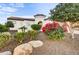 Exterior of the house with landscaping and rock accents at 17817 E Cindercone Rd, Rio Verde, AZ 85263