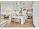 Bright kitchen with island, stainless steel appliances, and white cabinetry at 17817 E Cindercone Rd, Rio Verde, AZ 85263