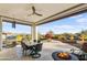 Covered patio with built-in grill, fire pit, and mountain views at 17817 E Cindercone Rd, Rio Verde, AZ 85263