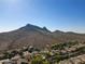 Aerial view of a residential area with mountain views in the background at 1801 E Paradise Ln, Phoenix, AZ 85022