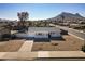 Single story home with mountain backdrop and spacious yard at 1801 E Paradise Ln, Phoenix, AZ 85022