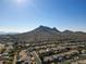 Aerial view of a residential area with mountain views in the background at 1801 E Paradise Ln, Phoenix, AZ 85022