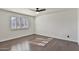 Bedroom featuring wood flooring and window shutters at 1801 E Paradise Ln, Phoenix, AZ 85022