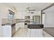 Modern kitchen with white cabinets and breakfast bar at 1801 E Paradise Ln, Phoenix, AZ 85022