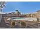 Relaxing kidney shaped pool and patio area at 1801 E Paradise Ln, Phoenix, AZ 85022