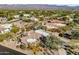 Aerial view of house nestled in a mountainside community at 18300 E Tonto Verde Dr, Rio Verde, AZ 85263