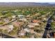 Aerial view showcasing house, golf course, and mountains at 18300 E Tonto Verde Dr, Rio Verde, AZ 85263