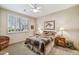 Guest bedroom with a comfortable bed and window shutters at 18300 E Tonto Verde Dr, Rio Verde, AZ 85263