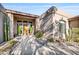 A double door entry welcomes you to this stucco home with desert landscaping at 18300 E Tonto Verde Dr, Rio Verde, AZ 85263