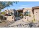 One-story home with a walkway leading to a double door entry at 18300 E Tonto Verde Dr, Rio Verde, AZ 85263