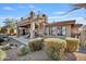 Home exterior with spiral staircase and desert landscaping at 18300 E Tonto Verde Dr, Rio Verde, AZ 85263