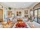 Tan colored living room features a fireplace and large windows at 18300 E Tonto Verde Dr, Rio Verde, AZ 85263