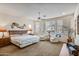 Main bedroom with sitting area and large windows at 18300 E Tonto Verde Dr, Rio Verde, AZ 85263