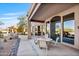 Covered patio with seating area and desert landscaping at 18300 E Tonto Verde Dr, Rio Verde, AZ 85263