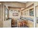 Wet bar with granite countertop and wooden cabinetry at 18300 E Tonto Verde Dr, Rio Verde, AZ 85263