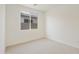 Simple bedroom with neutral decor and carpet flooring at 19028 W Rose Ln, Waddell, AZ 85355