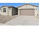 Modern two-car garage and front yard with gravel at 19028 W Rose Ln, Waddell, AZ 85355