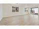 Bright and airy living room with sliding glass door to backyard at 19028 W Rose Ln, Waddell, AZ 85355