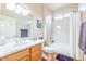 Clean bathroom with a tub, shower, and wood vanity at 19612 N Wasson Peak Dr, Surprise, AZ 85387