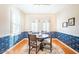 Charming dining room with blue floral wallpaper and a round wooden table at 19612 N Wasson Peak Dr, Surprise, AZ 85387