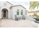 Brick patio with rocking chairs, offering a relaxing space at 19612 N Wasson Peak Dr, Surprise, AZ 85387