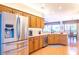 Modern kitchen featuring stainless steel appliances and wood cabinets at 19612 N Wasson Peak Dr, Surprise, AZ 85387