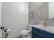 Stylish powder room with shiplap walls and a navy blue vanity at 19690 W Marshall Ave, Litchfield Park, AZ 85340