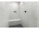 Clean shower with built-in seat and neutral tile at 19690 W Marshall Ave, Litchfield Park, AZ 85340