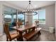 Charming dining area with a wooden table, bench, and sliding glass doors leading to the backyard at 19690 W Marshall Ave, Litchfield Park, AZ 85340