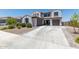 Two-story home with a two-car garage and nicely landscaped front yard at 19690 W Marshall Ave, Litchfield Park, AZ 85340