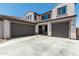 Two-story home with a three-car garage and landscaped front yard at 19690 W Marshall Ave, Litchfield Park, AZ 85340