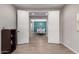 Bright hallway with white doors and wood-look flooring at 19690 W Marshall Ave, Litchfield Park, AZ 85340