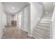 Modern staircase with light gray risers and white railings at 19690 W Marshall Ave, Litchfield Park, AZ 85340