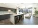 Modern kitchen with island, stainless steel appliances, and stylish backsplash at 200 W Portland St # 715, Phoenix, AZ 85003