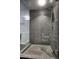 Large walk-in shower with glass enclosure and gray tile at 200 W Portland St # 715, Phoenix, AZ 85003