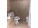 Bathroom with toilet and tiled floors and walls at 2029 N 22Nd Pl, Phoenix, AZ 85006