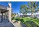 Spacious backyard with grass, trees, and a basketball court at 20997 N 79Th Ave, Peoria, AZ 85382