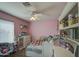 Bedroom with a bed, dresser and built-in shelving at 20997 N 79Th Ave, Peoria, AZ 85382