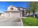 Two-story house with three-car garage and manicured lawn at 20997 N 79Th Ave, Peoria, AZ 85382