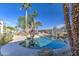 Stunning kidney-shaped pool with palm trees and basketball court view at 20997 N 79Th Ave, Peoria, AZ 85382