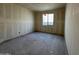 Unfinished bedroom with window and neutral wall coverings at 22851 E Lords Way, Queen Creek, AZ 85142