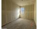 Well-lit bedroom with window and unfinished walls at 22851 E Lords Way, Queen Creek, AZ 85142