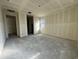 Unfinished main bedroom with access to hallway and window at 22851 E Lords Way, Queen Creek, AZ 85142