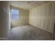 Bright bedroom featuring a window and unfinished walls at 22851 E Lords Way, Queen Creek, AZ 85142