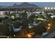 Night aerial view showcasing city lights and mountain backdrop at 2323 N Central Ave # 906, Phoenix, AZ 85004