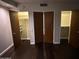 Bedroom with double door closets and dark hardwood floors at 2323 N Central Ave # 906, Phoenix, AZ 85004