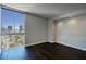 Bright bedroom with dark hardwood floors and city view at 2323 N Central Ave # 906, Phoenix, AZ 85004