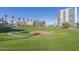 Expansive grassy park with a circular pathway, located near high-rise buildings at 2323 N Central Ave # 906, Phoenix, AZ 85004