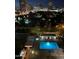 Night view of a community pool and city skyline at 2323 N Central Ave # 906, Phoenix, AZ 85004