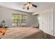 Bedroom with large windows, ceiling fan, and ample closet space at 2333 E Southern Ave # 2041, Tempe, AZ 85282